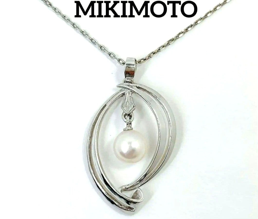 Set of four including Mikimoto silver pearl necklace, Nina Ricci necklace, Nina Ricci handkerchief, and cosmetic item