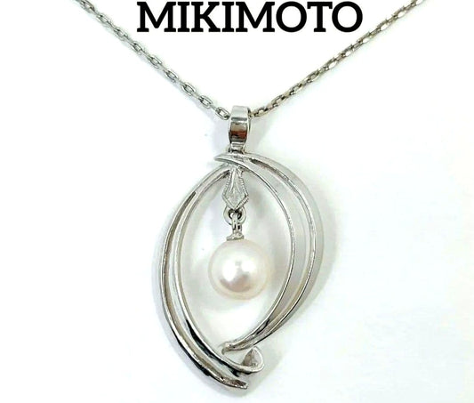 Set of four including Mikimoto silver pearl necklace, Nina Ricci necklace, Nina Ricci handkerchief, and cosmetic item