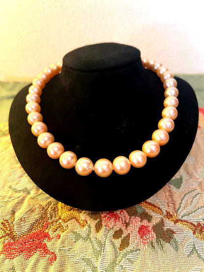 SV hollow nucleated natural freshwater pearl necklace in pale pink with silver clasp, 43.5 cm length, 12 mm to 10 mm pearls