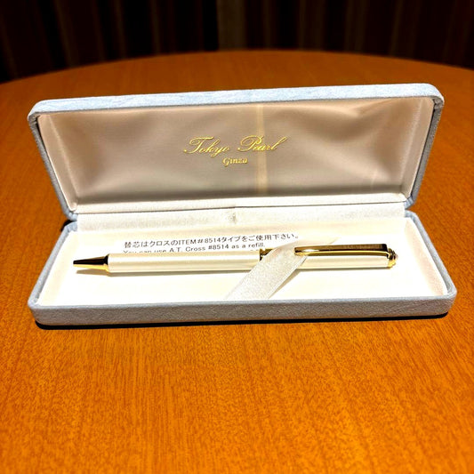 Tokyo Pearl A.T. Cross 8514 gold ballpoint pen featuring a pearl accent on top and included case