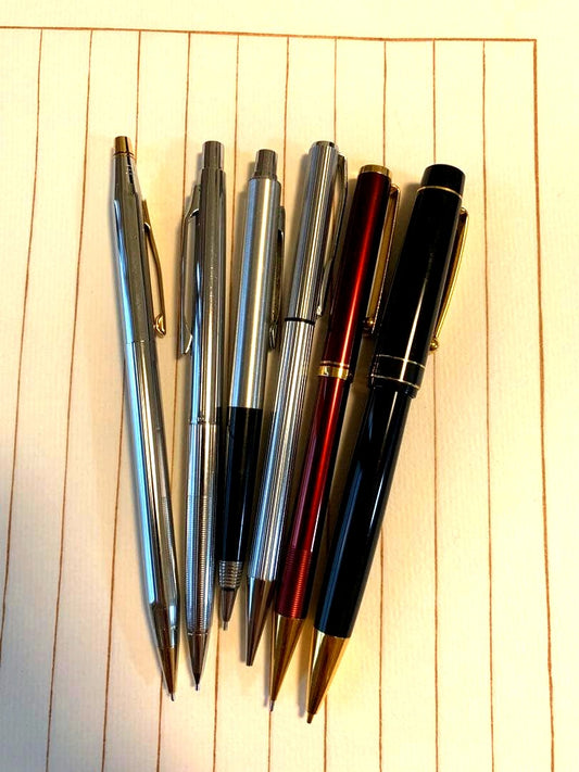 Set of six mechanical pencils including Pilot brand with NO.4237 insertion displayed