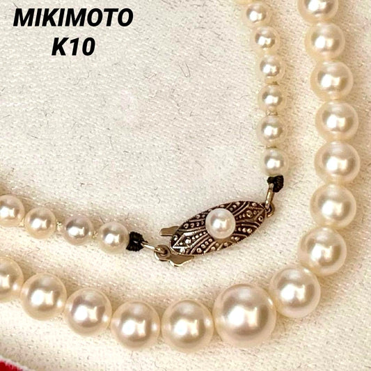 MIKIMOTO Gradient Necklace with cultured pearls ranging 3.6 to 7.0 mm and K10 metal clasp on a white background