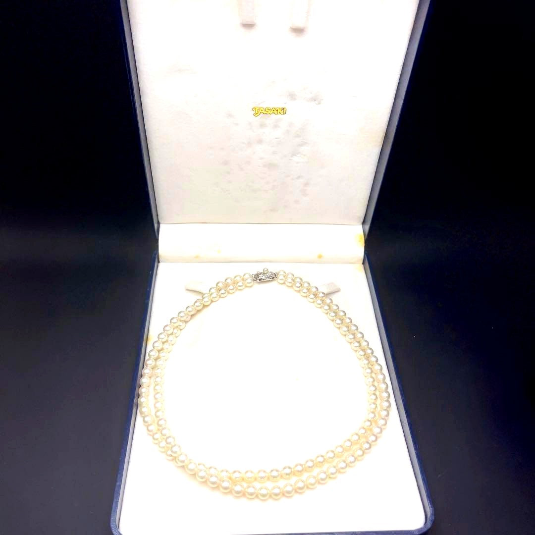 Takashi Akoya pearl two-strand necklace with silver clasp and 6-6.5 mm pearls on a white background