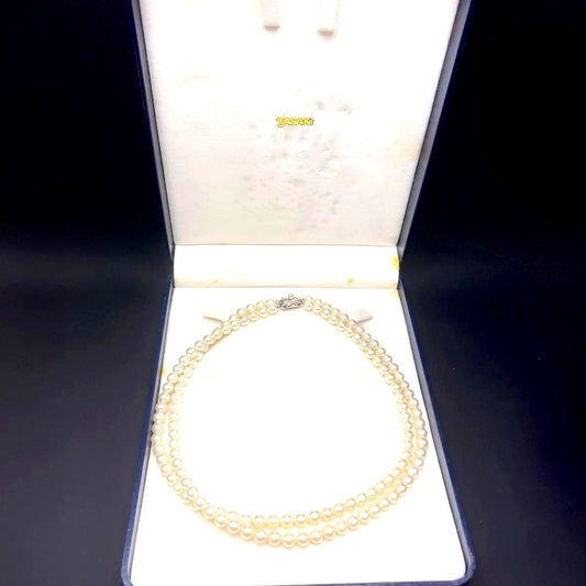 Takashi Akoya pearl two-strand necklace with silver clasp and 6-6.5 mm pearls on a white background
