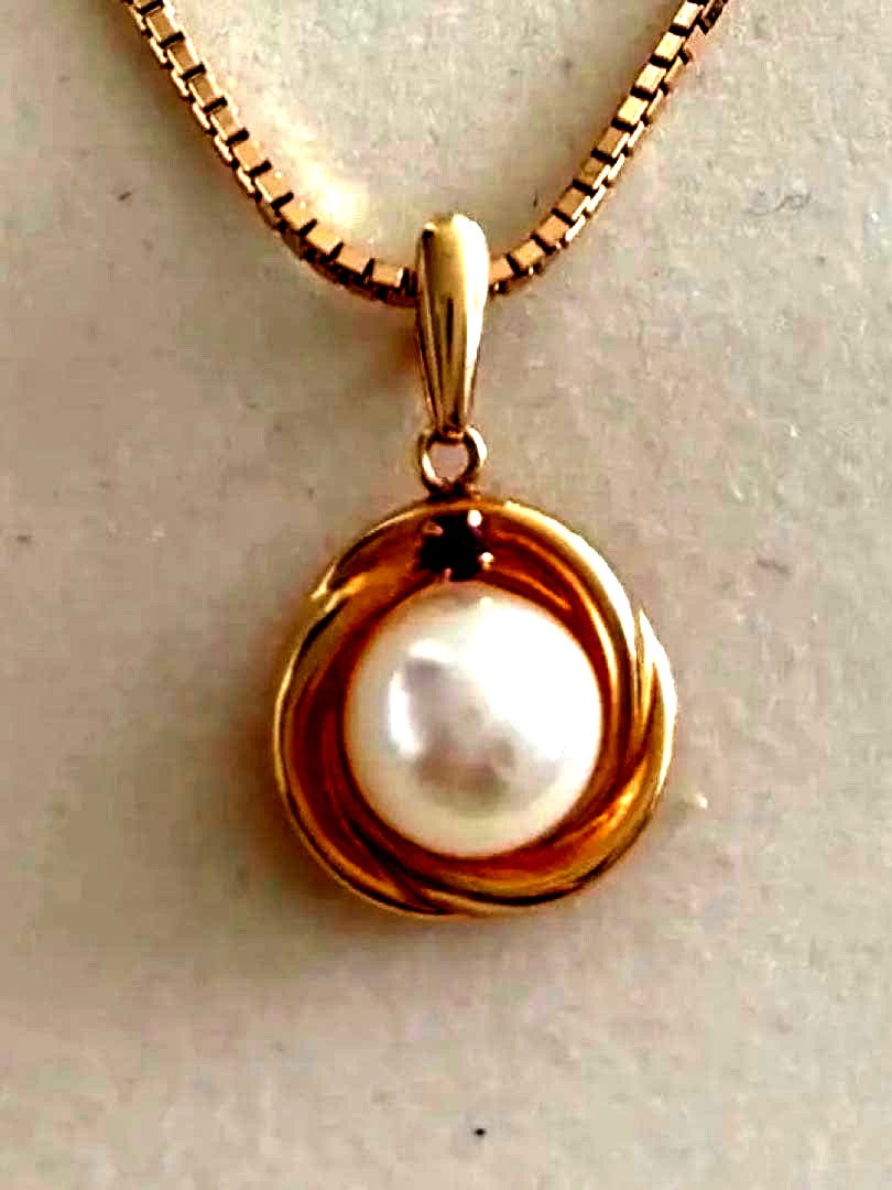 Law K18 Pearl pendant top featuring a ruby set in 18K gold with no chain or case included