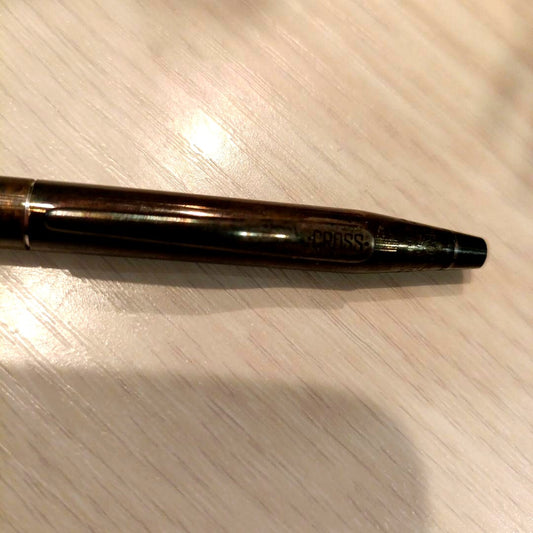 Vintage Cross silver ballpoint pen with simple body and visible oxidation