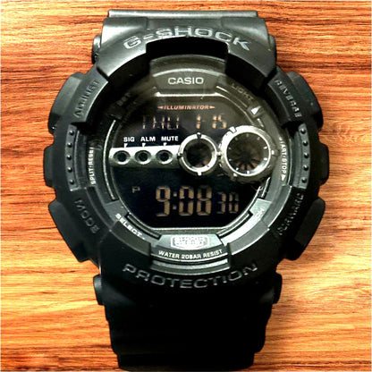 Casio G-Shock GD100 digital watch with black rubber strap and digital display