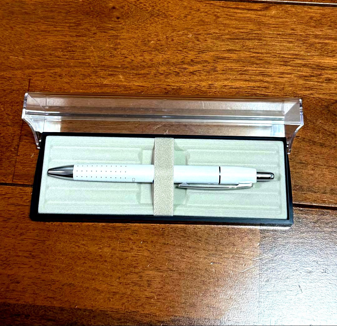 PILOT Ballpoint Pen coupe model with sleek black body and silver clip on white background