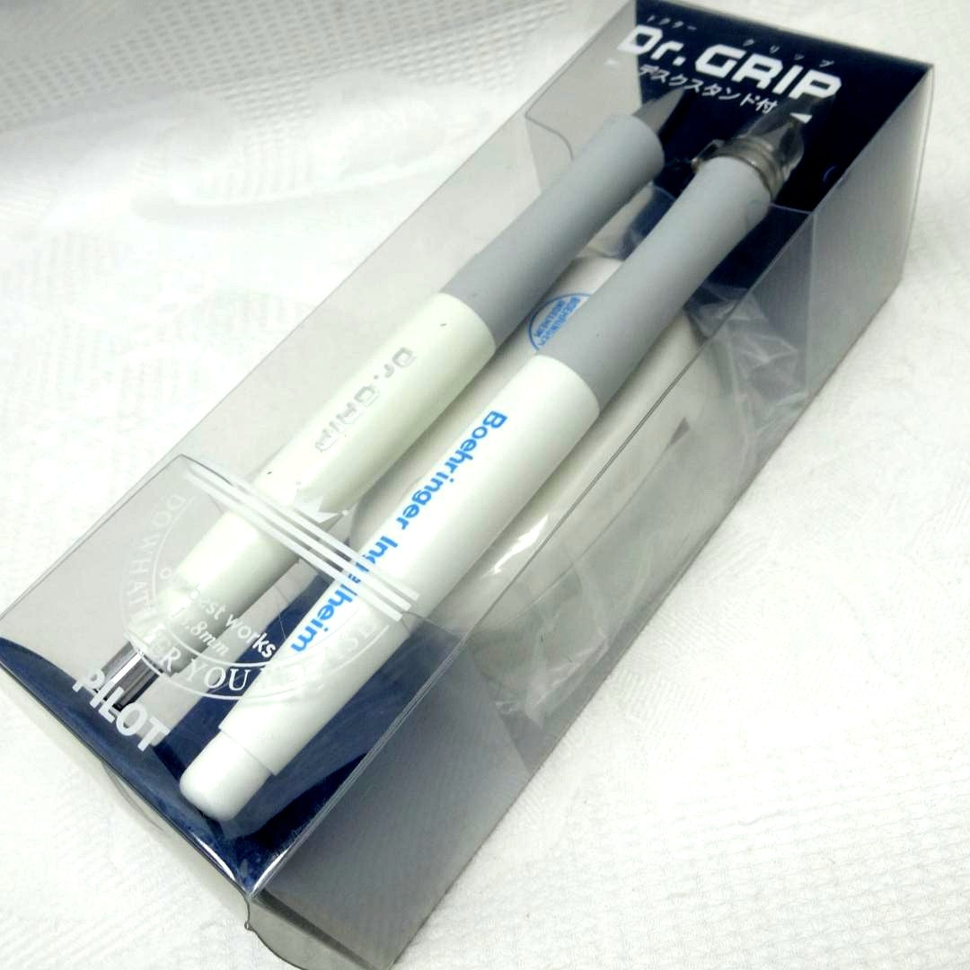 Dr.GRIP initial model ballpoint pen and mechanical pencil set with black desk stand on white background