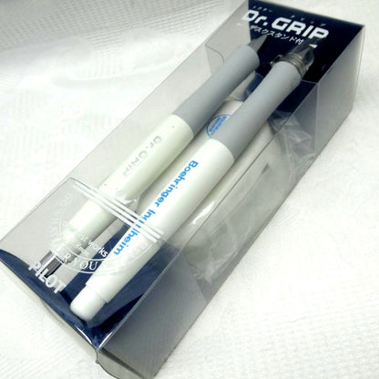 Dr.GRIP initial model ballpoint pen and mechanical pencil set with black desk stand on white background