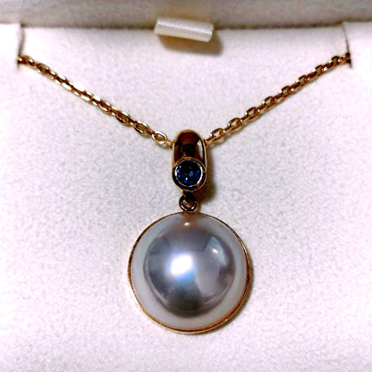 Tasaki Pearl Sapphire Necklace in 18K Yellow Gold with 60cm chain and 25mm x 14.5mm pendant