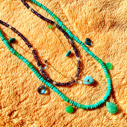 agete 10K gold necklace with three strands featuring blue turquoise and tanzanite stones