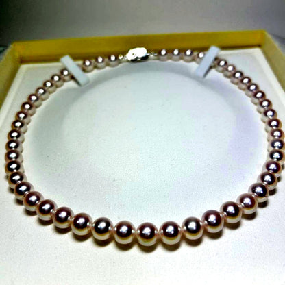 Akoya pearl necklace with 8-8.5 mm pearls and silver clasp on a white background