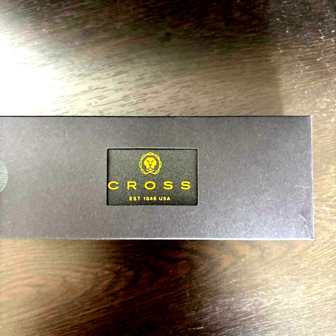 New CROSS black ballpoint pen displayed with its original box on a white background
