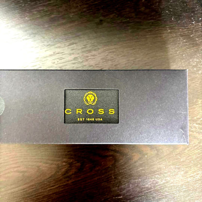 New CROSS black ballpoint pen displayed with its original box on a white background