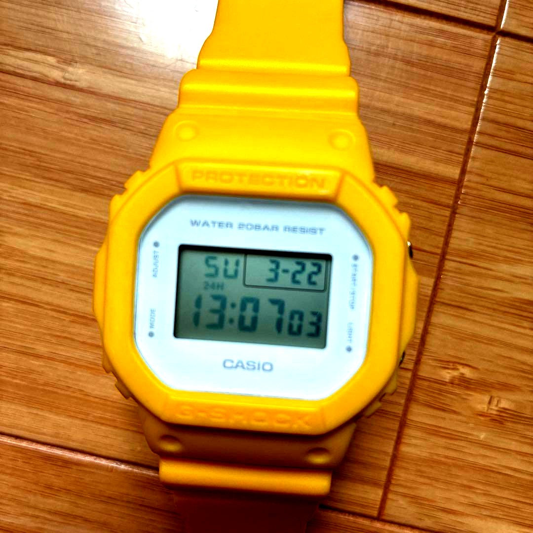 Yellow Casio G-Shock digital watch with shock resistant and water resistant features, includes band