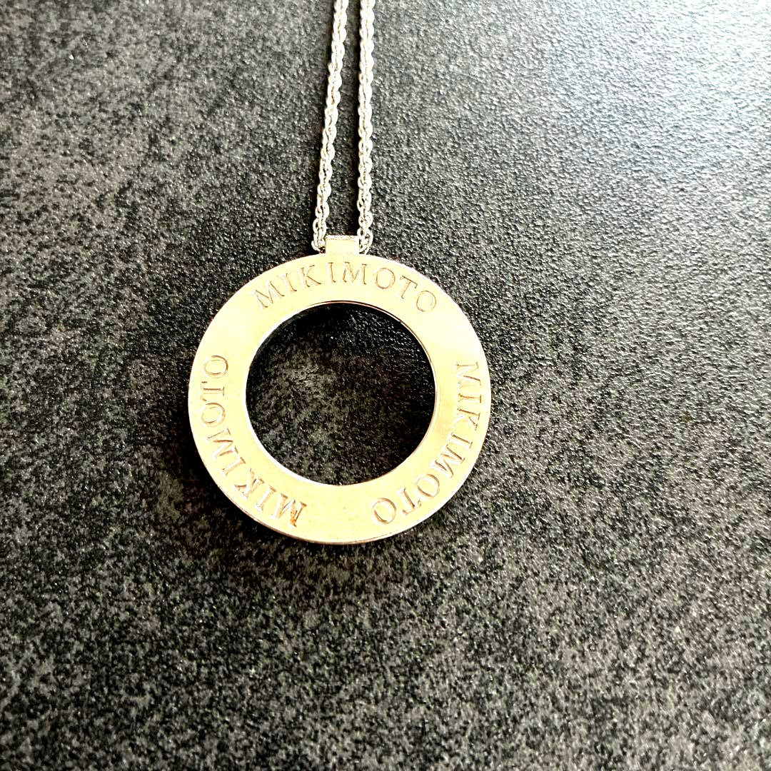 MIKIMOTO silver Circle Logo Necklace with 3 cm diameter pendant on a delicate chain