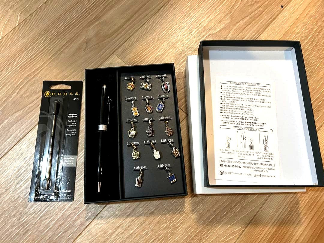Toyota Crown Emblem Charm Pen Set showing exterior dirt, displayed open for photography