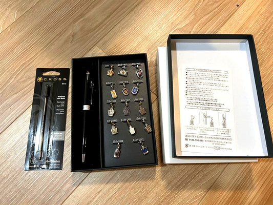 Toyota Crown Emblem Charm Pen Set showing exterior dirt, displayed open for photography