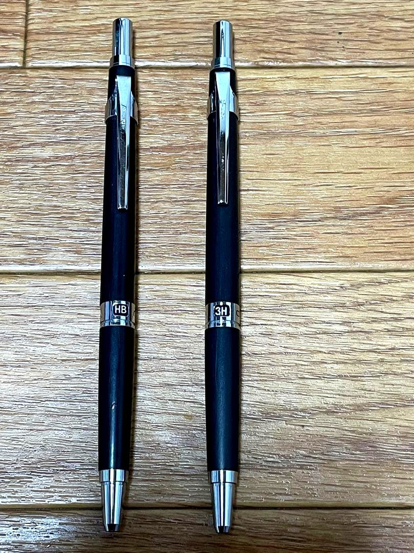 Two used Pilot Hi-Meka Holder Initial Model pieces showing some scratches and stains