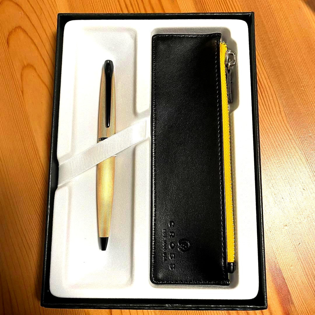 Cross ATX Brush Royal Gold ballpoint pen case with minor discoloration and scratches shown in original box
