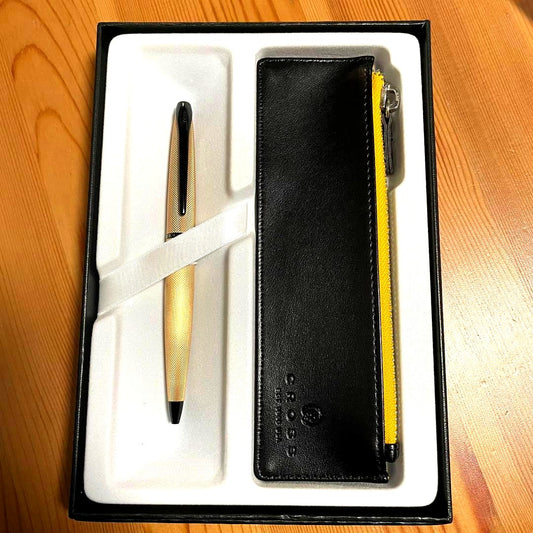 Cross ATX Brush Royal Gold ballpoint pen case with minor discoloration and scratches shown in original box
