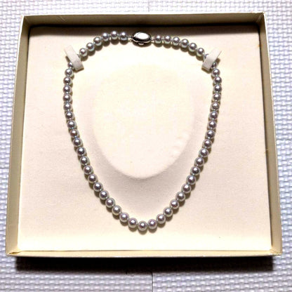 Takashi Pearl Necklace with 7.1-7.4mm pearls, 44cm length, and silver clasp on white background