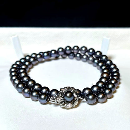 Akoya Pearl Necklace with 6.5-7.0mm round dark purple and dark gray pearls on a silver chain, 42.5cm long