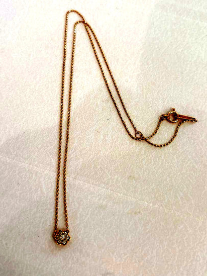 Agete flower motif necklace with 0.08ct diamond and adjustable 40.5 cm chain on white background