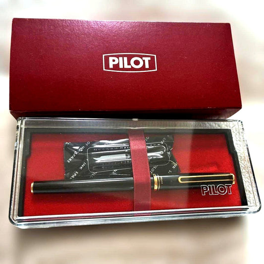 Pilot black fountain pen with gold decorations, included case, and two ink cartridges