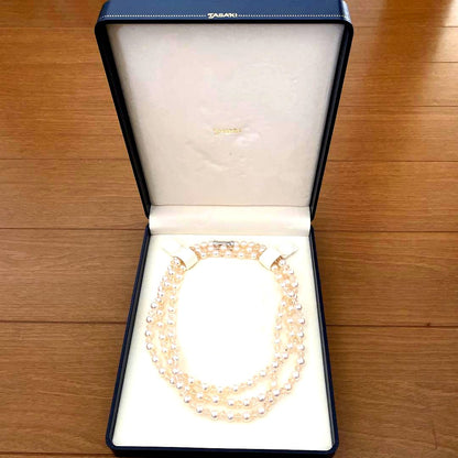 TASAKI pink pearl long necklace displayed on white background