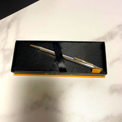 Cross ballpoint pen with silver and gold design displayed with its premium dedicated case