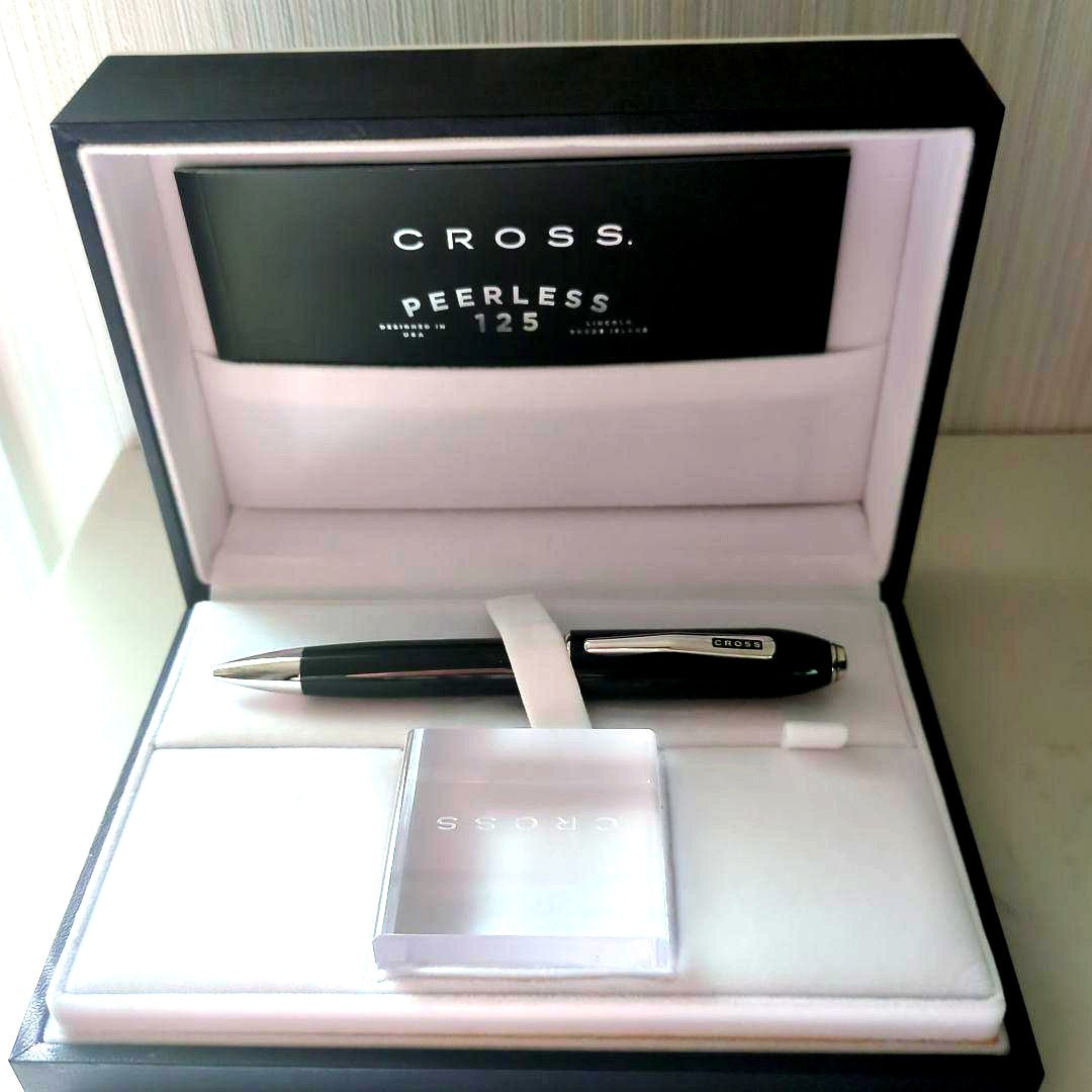 Cross Peerless 125 black ballpoint pen with dedicated case shown against white background