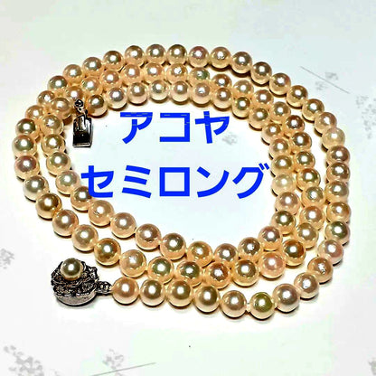 Akoya pearl semi-long necklace approx 64cm with 6-6.5mm white pearls showing slight irregularities and strong luster