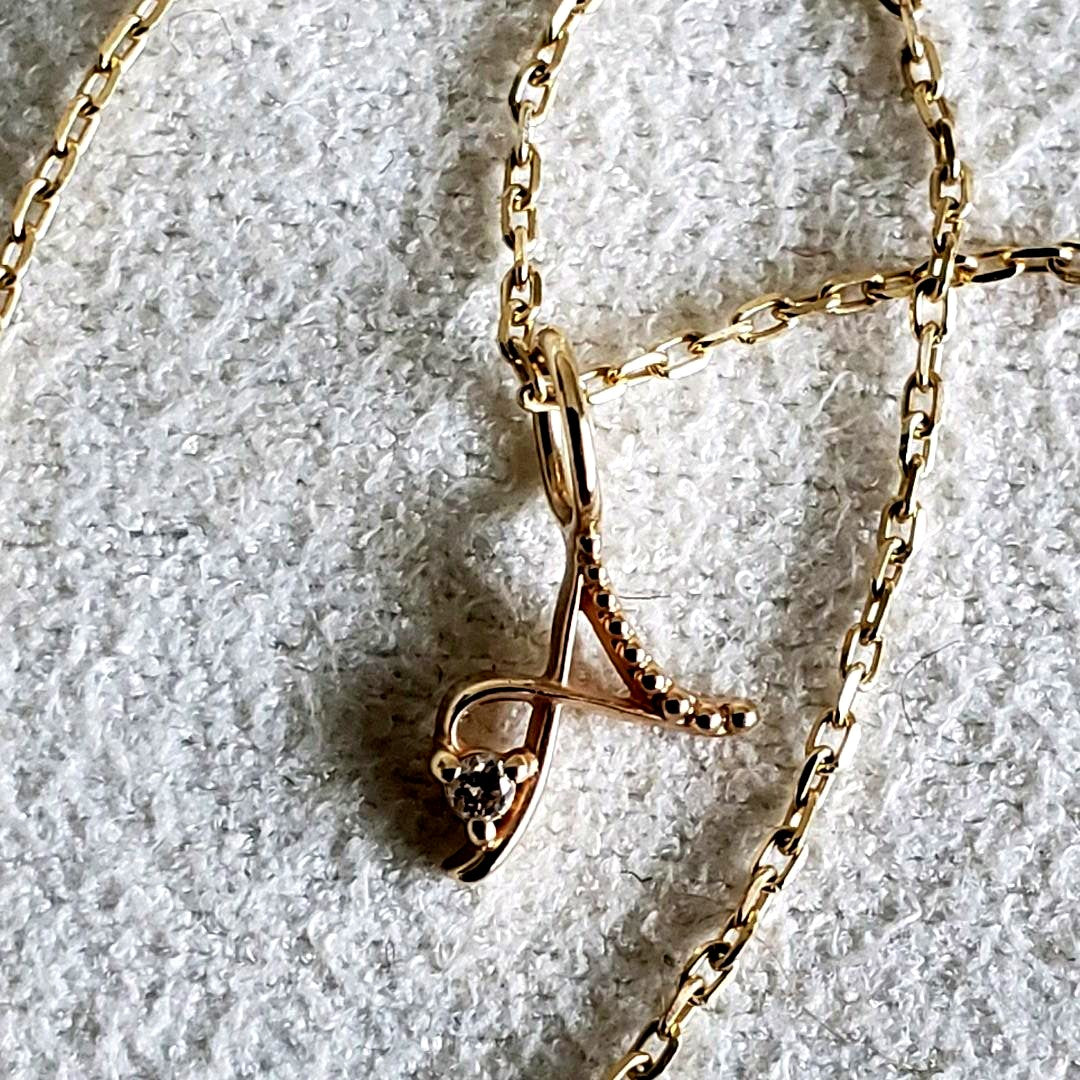 Gold K10 initial necklace with diamond letter A pendant and adjustable chain