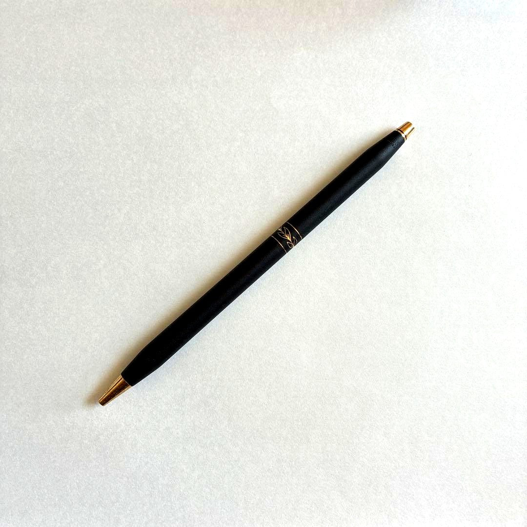 Cross Classic 2542 vintage ladies ballpoint pen with satin black body, gold trim, and intricate leaf engraving