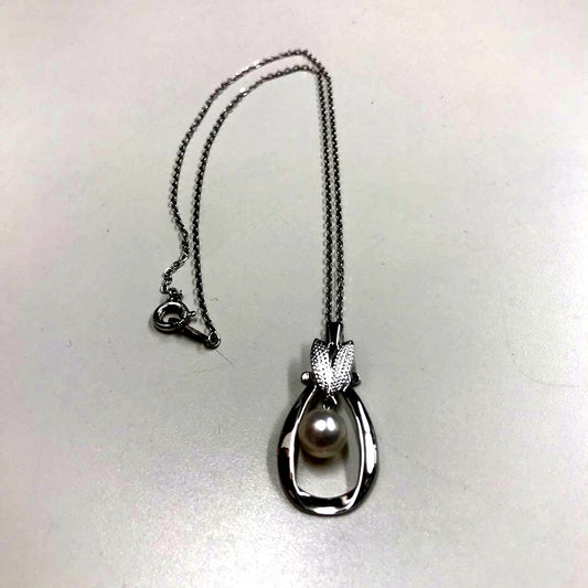 Mikimoto silver pearl necklace featuring 6.8mm round pearls on a silver chain