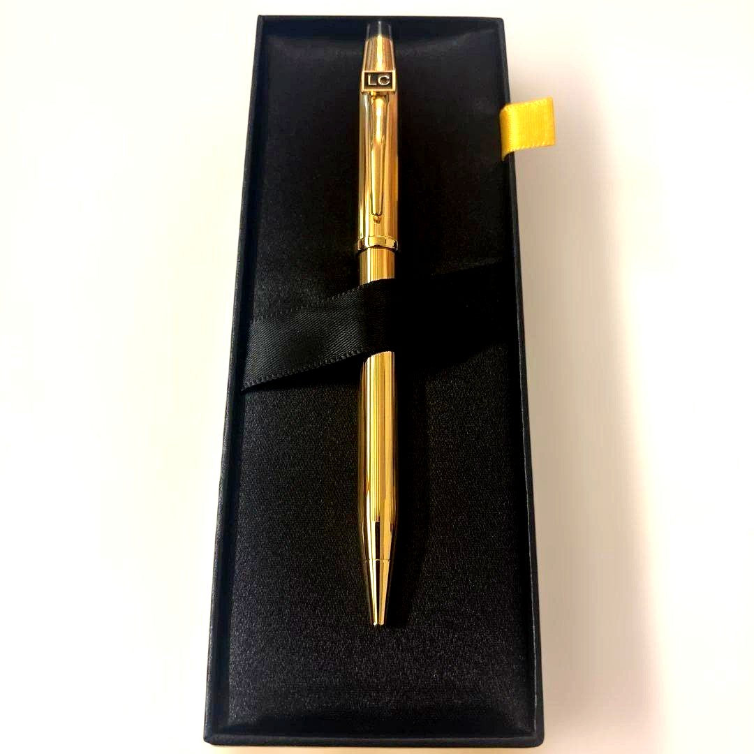 Luxury Card Cross gold ballpoint pen with LC logo on a white background