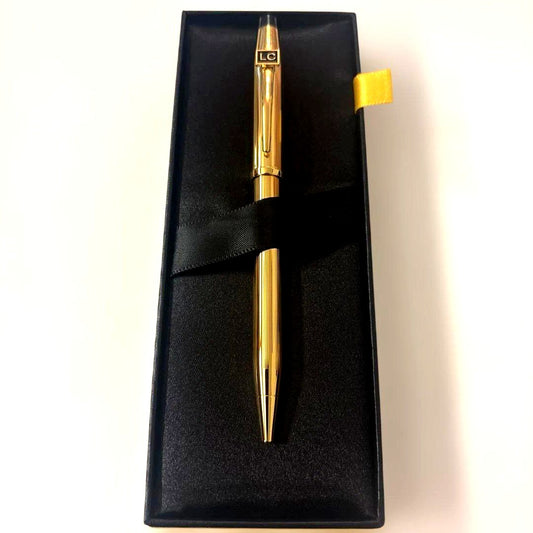 Luxury Card Cross gold ballpoint pen with LC logo on a white background