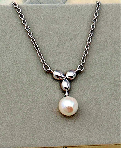 Tasaki Akoya pearl necklace with round pearls on a silver chain