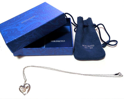 Mikimoto Pearl Heart Necklace featuring a silver heart pendant with a single pearl