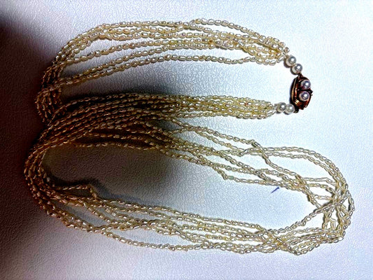 14k Akoya Keshi pearl necklace with ruby clasp 60cm displayed on white background