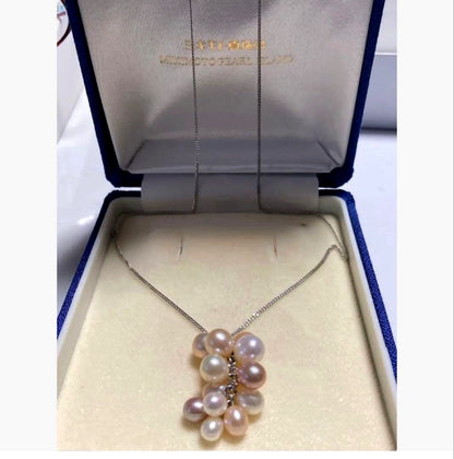 Mikimoto Pearl Island beaded necklace with 14 pearls of various sizes and colors on a 40 cm chain