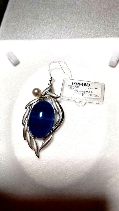 Brooch and pendant set with 7.5mm Akoya pearl, blue calcite, silver frame on white background
