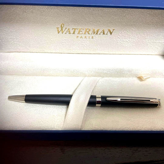 WATERMAN Ballpoint Pen with matte black body and silver trim next to a matching dedicated case