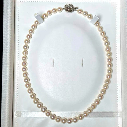 Akoya pearl semi-round necklace measuring 6.9 to 7.3mm with a 43 cm length displayed on a white background