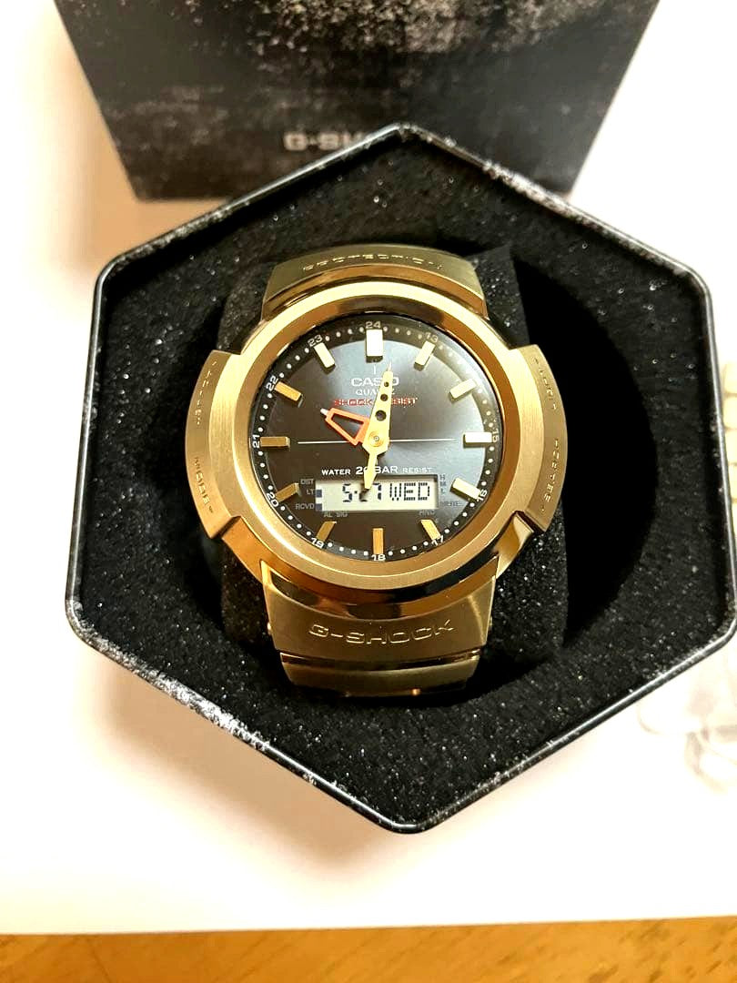 Casio G-Shock AWM500GD gold and black quartz watch with 20 ATM water resistance and radio solar movement