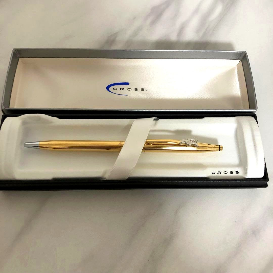 CROSS Ballpoint Pen with sleek silver barrel and black ink tip on white background