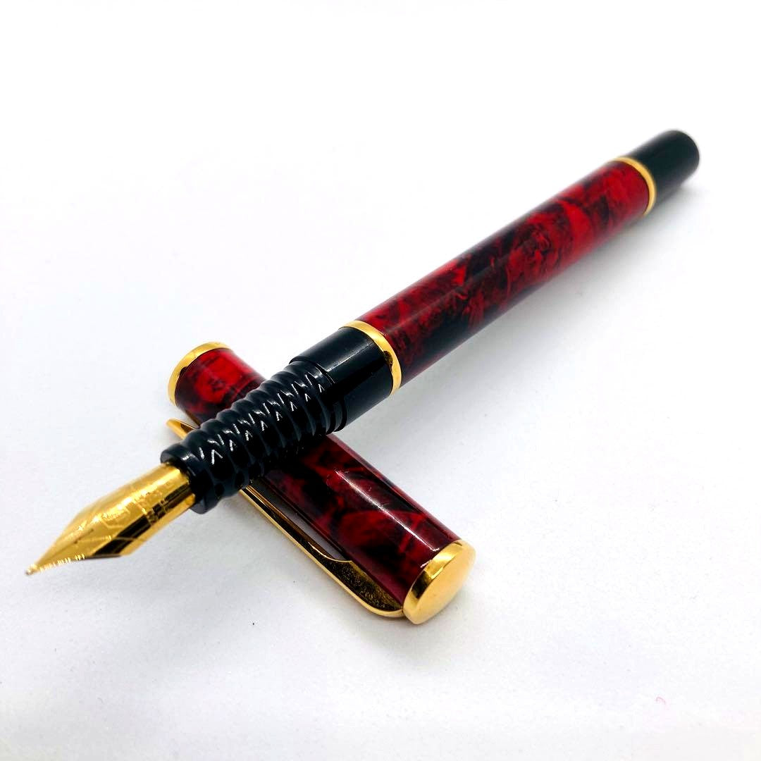 Waterman Lorea Red Marble fountain pen with extra fine nib, shown uncapped on white background