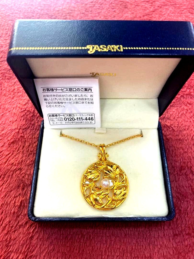 Tasaki Baby Pearl Loupe Necklace with gold color and genuine pearls displayed on a white background